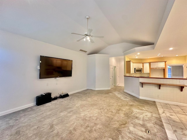 unfurnished living room with lofted ceiling, ceiling fan, and light carpet