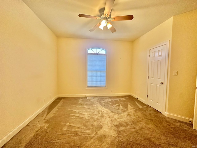 carpeted empty room with ceiling fan