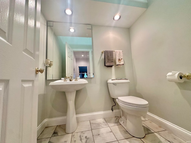 bathroom featuring toilet