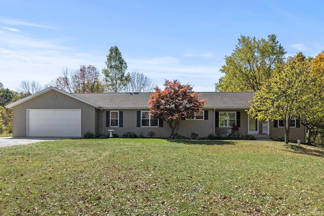 single story home with a front yard and a garage