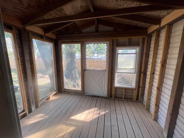 unfurnished sunroom with wood ceiling and lofted ceiling with beams