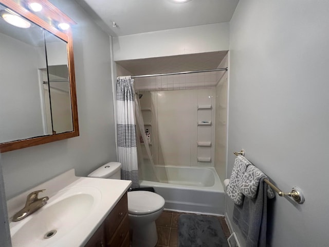 full bathroom featuring vanity, tile patterned floors, toilet, and shower / tub combo with curtain