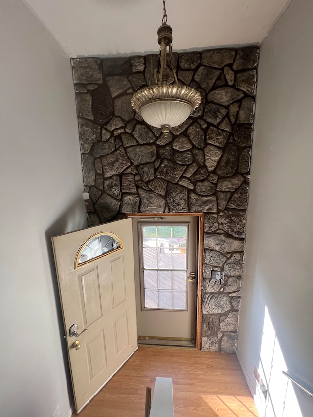 foyer entrance with hardwood / wood-style flooring