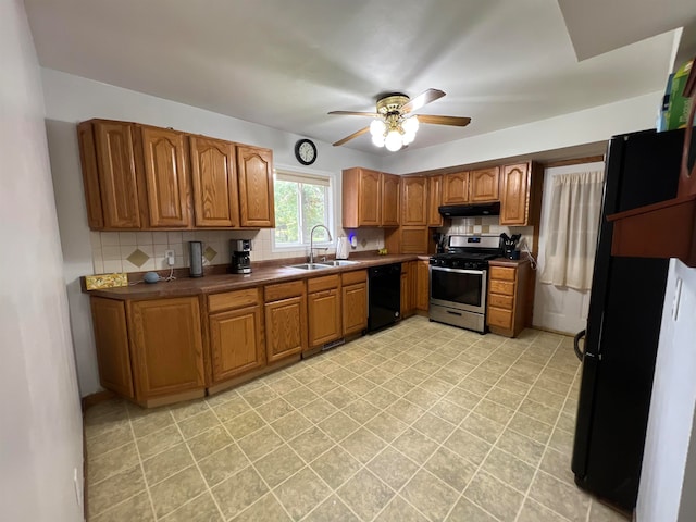 kitchen with ceiling fan, backsplash, sink, and black appliances