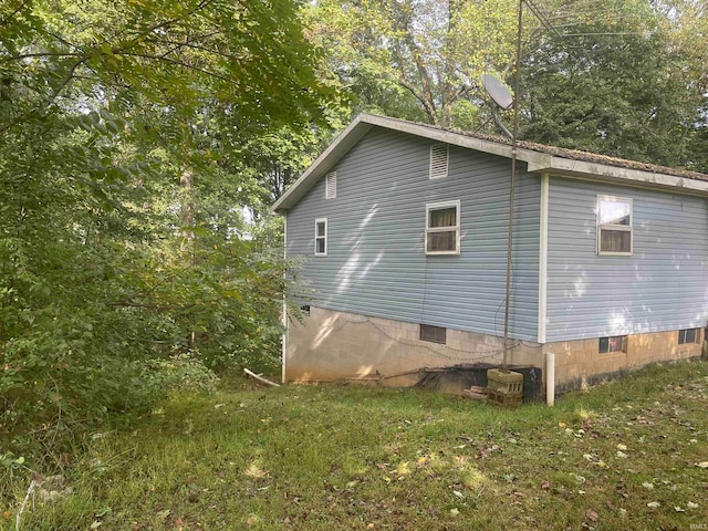 view of home's exterior featuring a yard