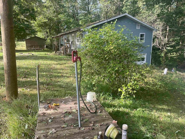 view of yard featuring a wooden deck