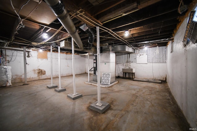 basement with sink and heating unit