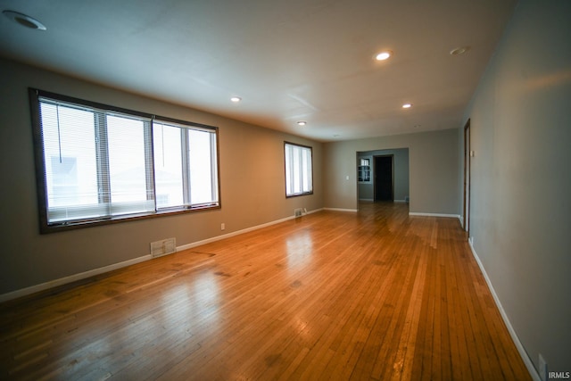 unfurnished room featuring hardwood / wood-style flooring