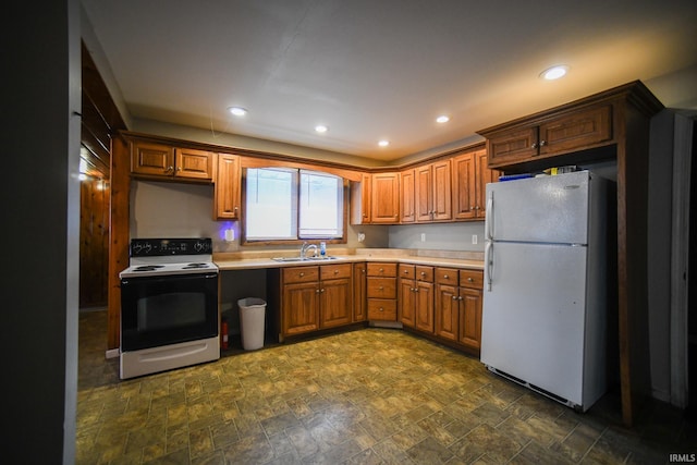 kitchen featuring sink and white appliances