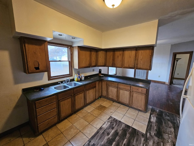 kitchen with sink and light tile patterned flooring