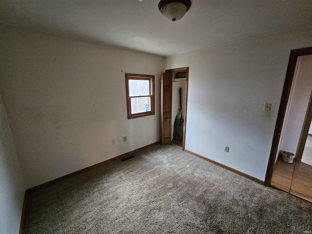 unfurnished bedroom featuring carpet floors