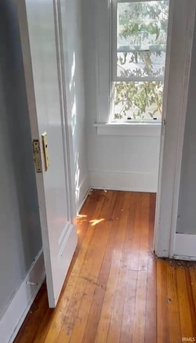 hallway with light wood-type flooring