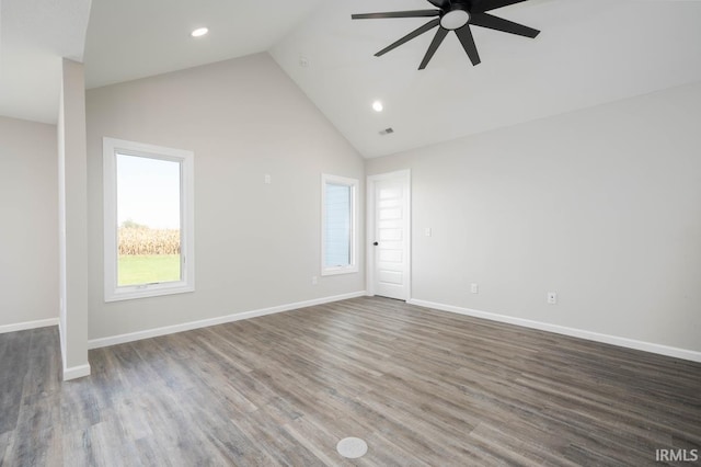 unfurnished living room with wood finished floors, recessed lighting, ceiling fan, and high vaulted ceiling