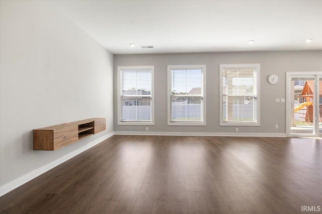 unfurnished room featuring dark hardwood / wood-style flooring