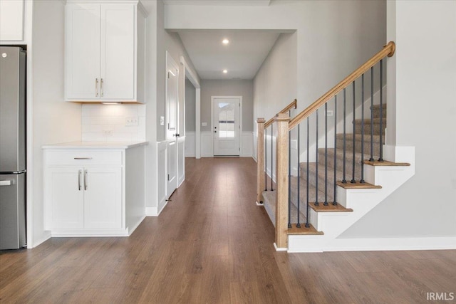 entrance foyer featuring dark hardwood / wood-style floors