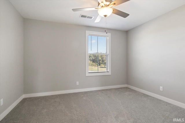 spare room with ceiling fan and carpet floors