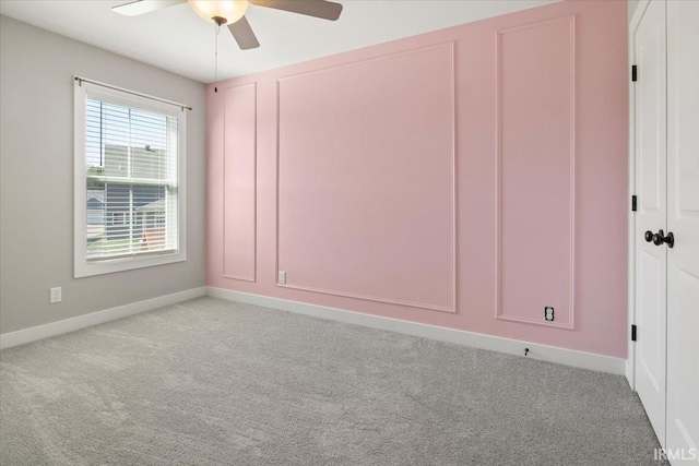 unfurnished room featuring light carpet and ceiling fan