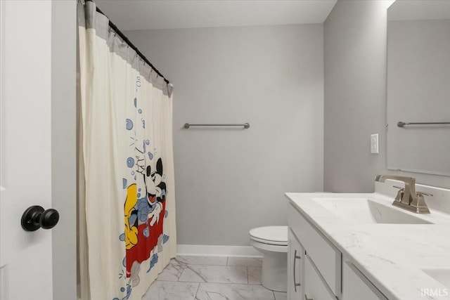 bathroom featuring vanity, toilet, and a shower with curtain