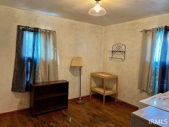 living area with dark wood-type flooring