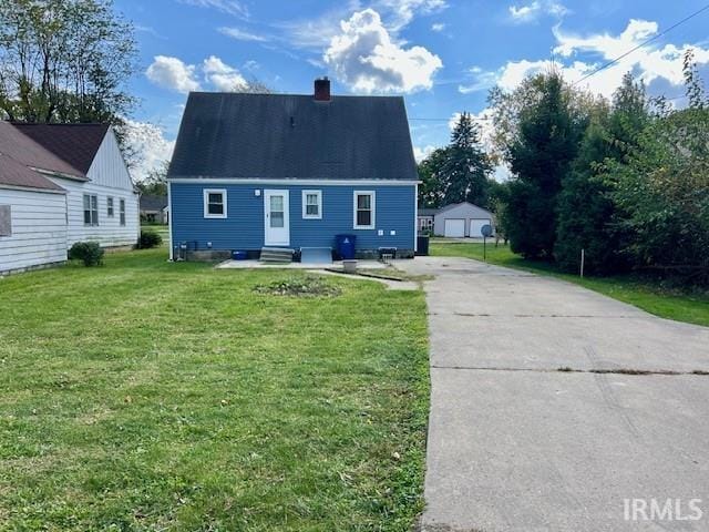 cape cod home with a front lawn