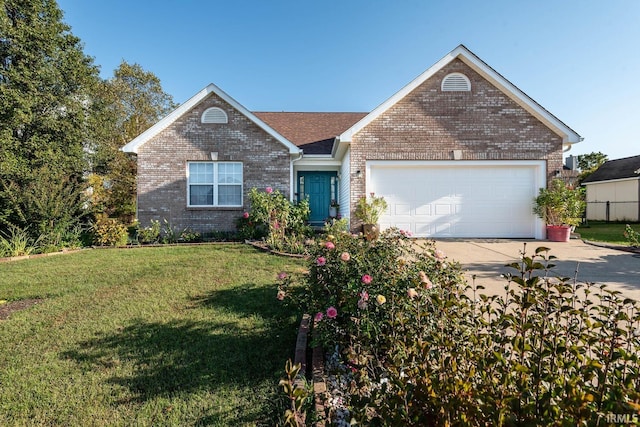 view of front of home with a garage and a front yard