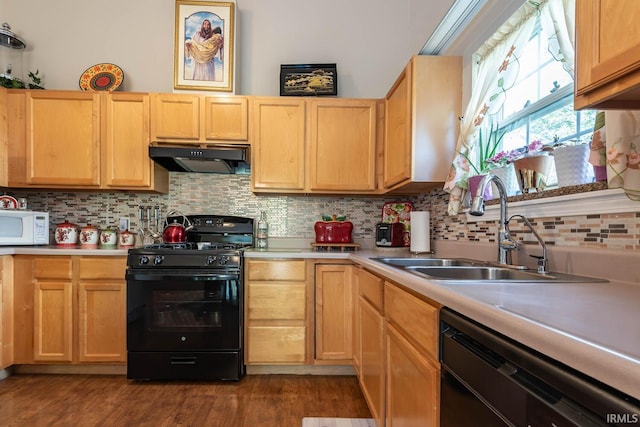 kitchen featuring black appliances, light brown cabinets, dark hardwood / wood-style floors, sink, and backsplash