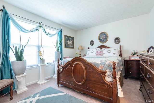 carpeted bedroom with a textured ceiling