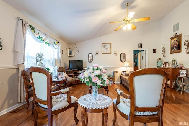 interior space featuring hardwood / wood-style floors, ceiling fan, and vaulted ceiling