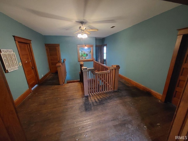 hallway with dark hardwood / wood-style floors