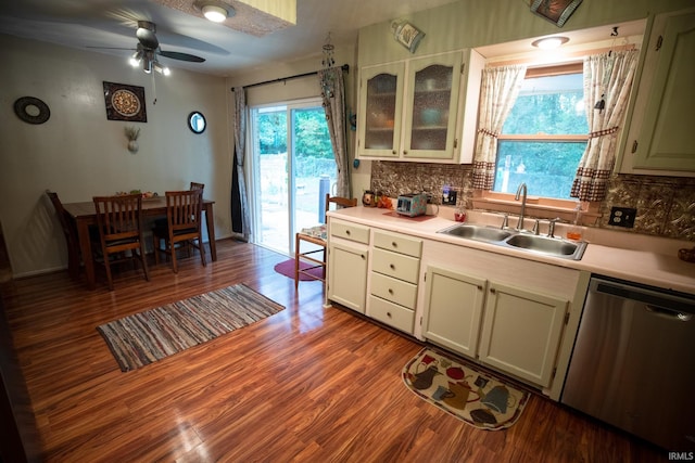 kitchen with ceiling fan, tasteful backsplash, light hardwood / wood-style flooring, sink, and dishwasher