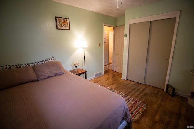 bedroom featuring a closet and wood-type flooring