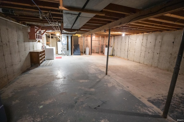 basement with washer / clothes dryer and water heater