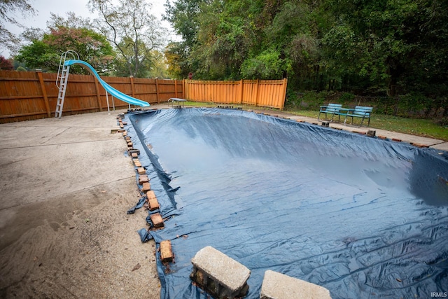 view of swimming pool featuring a water slide