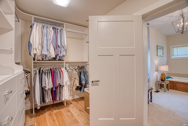 walk in closet featuring light hardwood / wood-style floors