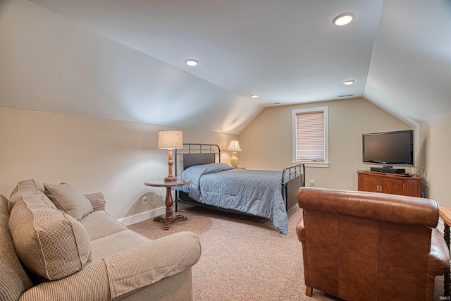 carpeted bedroom featuring vaulted ceiling