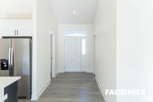 corridor with hardwood / wood-style flooring