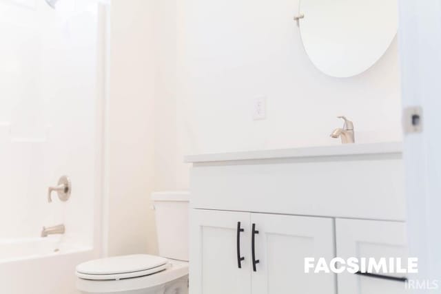 full bathroom featuring vanity, bathing tub / shower combination, and toilet