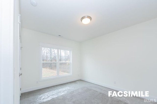 view of carpeted spare room