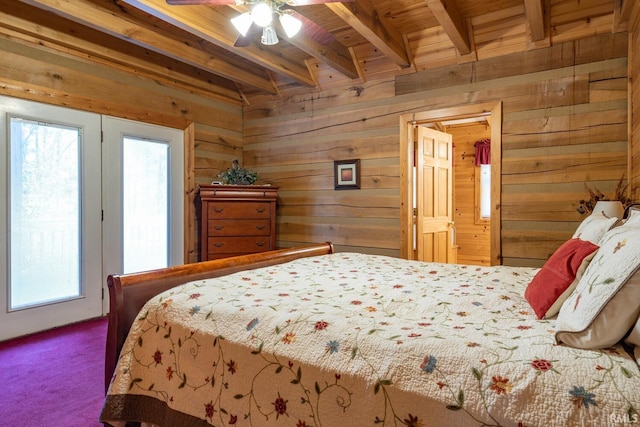 carpeted bedroom with wood walls, wood ceiling, beam ceiling, and ceiling fan