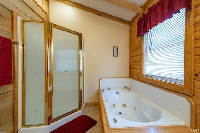 bathroom featuring separate shower and tub, wooden walls, lofted ceiling with beams, and plenty of natural light