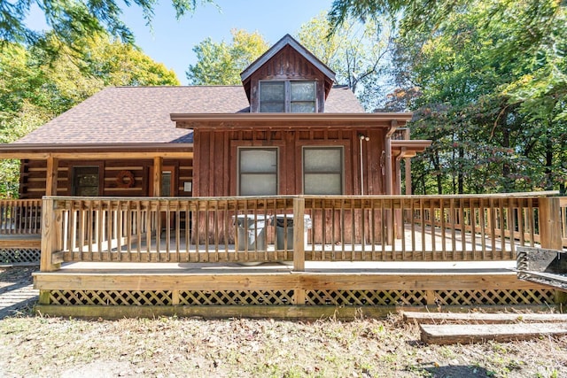 1291 N Sewell Rd, Bloomington, IN 47408 - view of front facade featuring a shingled roof, a deck, and log exterior