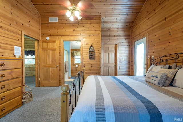 carpeted bedroom with high vaulted ceiling, ceiling fan, wood walls, and wood ceiling