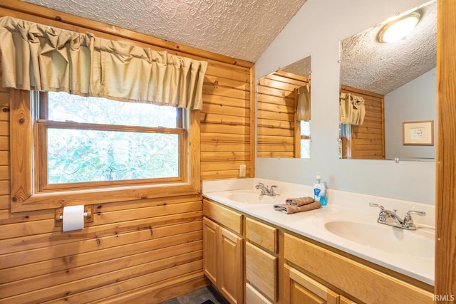 1291 N Sewell Rd, Bloomington, IN 47408 - full bathroom with lofted ceiling, a textured ceiling, double vanity, and wood walls