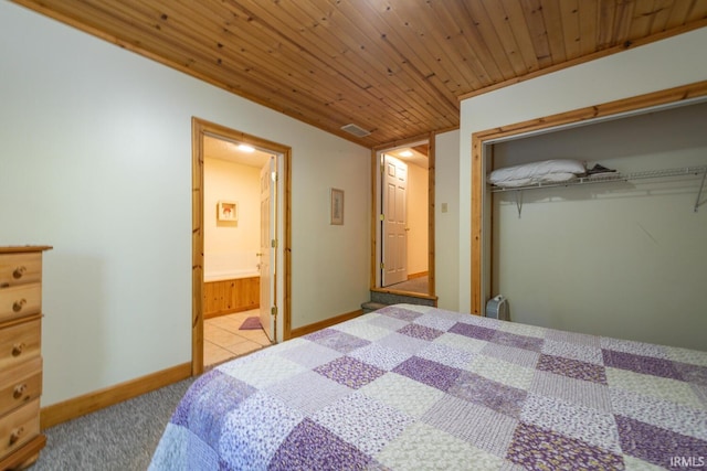 1291 N Sewell Rd, Bloomington, IN 47408 - carpeted bedroom with a closet, wooden ceiling, baseboards, and connected bathroom