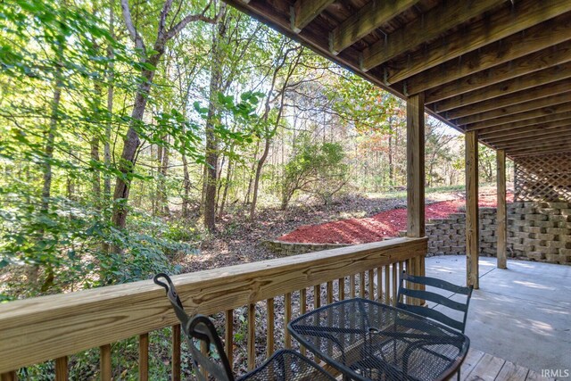 1291 N Sewell Rd, Bloomington, IN 47408 - wooden terrace featuring a patio and outdoor dining space