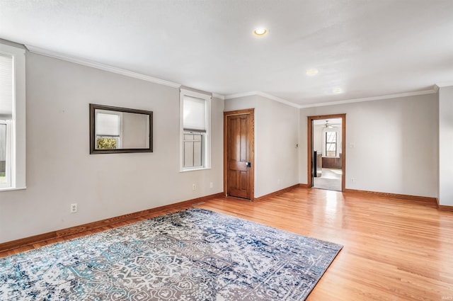 unfurnished room with crown molding and hardwood / wood-style floors