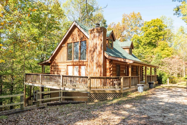 view of property exterior with a deck