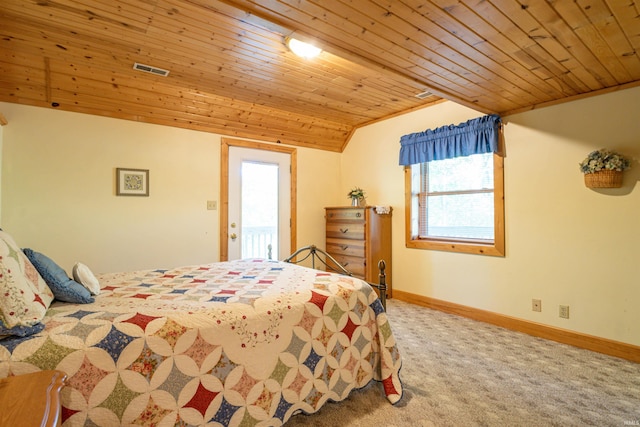 carpeted bedroom featuring lofted ceiling and wooden ceiling