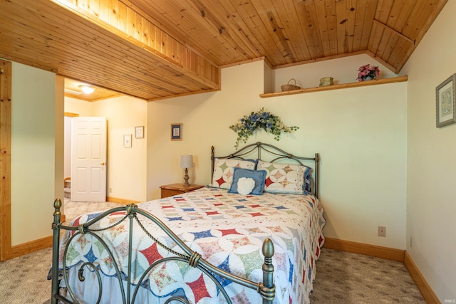 bedroom featuring ornamental molding, vaulted ceiling, wood ceiling, and carpet floors