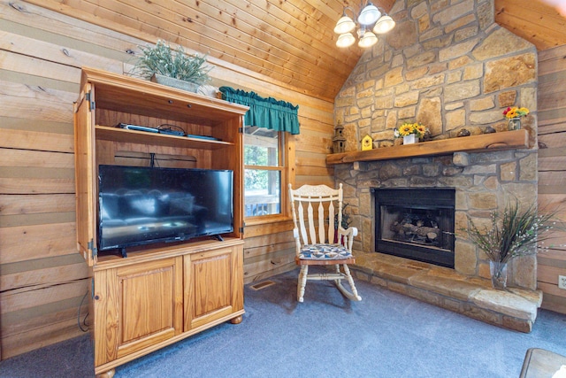 carpeted living room featuring lofted ceiling, wood walls, wood ceiling, and a fireplace